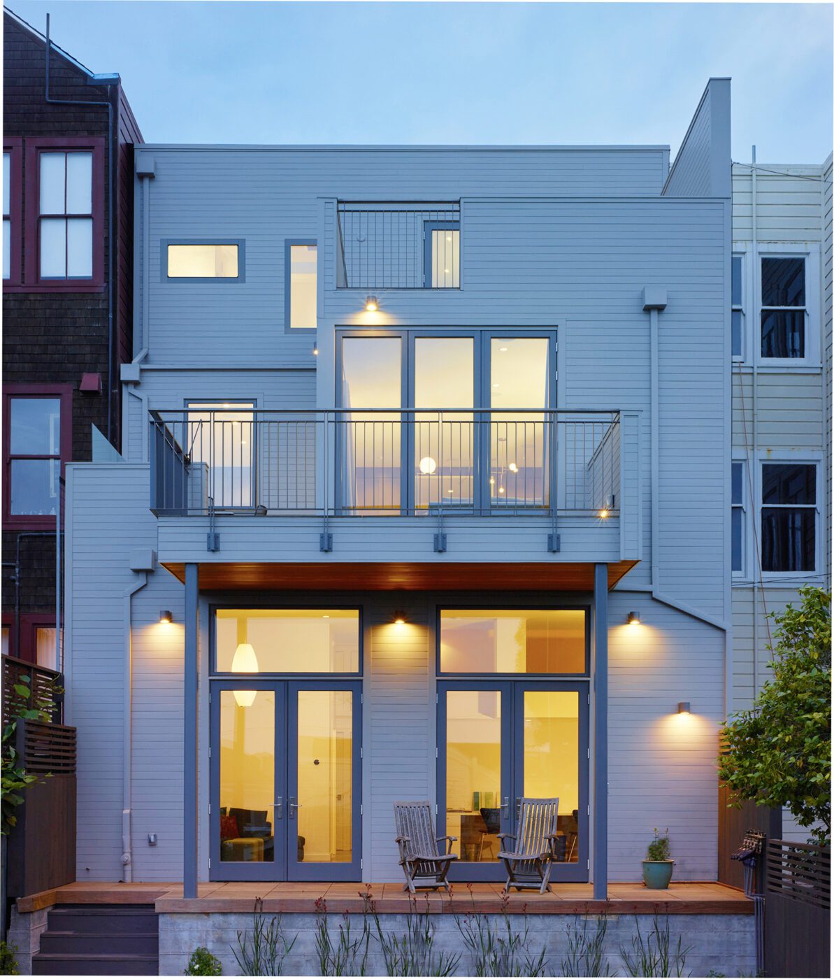 Modern Edwardian renovation back deck Dusk shot with deck chairs