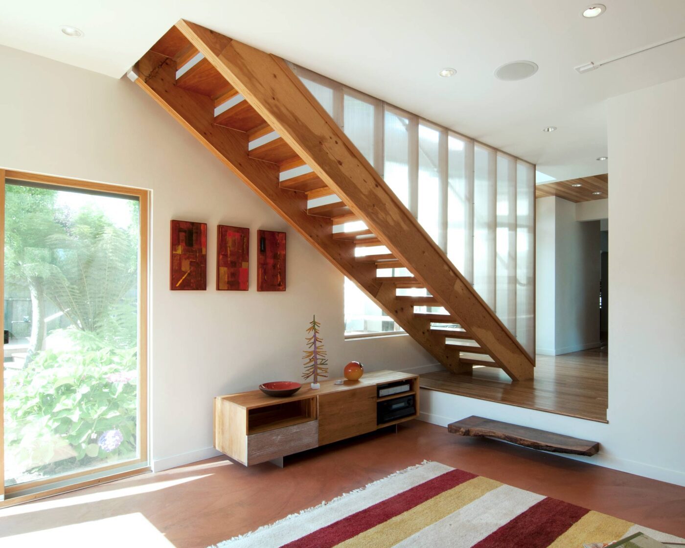Modern Wood Staircase in Berkeley ADU with red and yellow rug