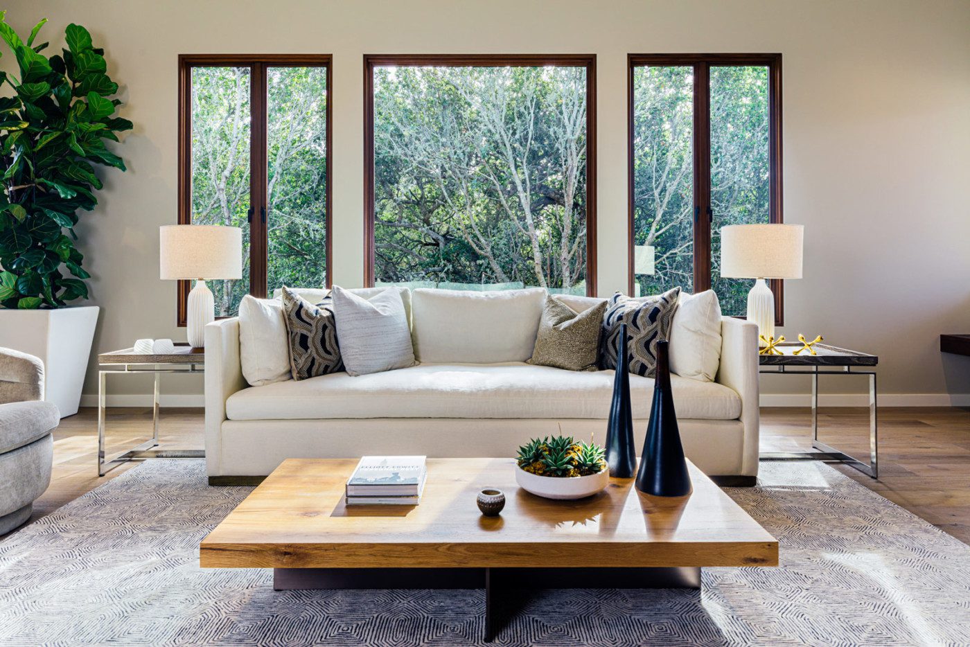 modern rustic living room with white couch and wooden window frames