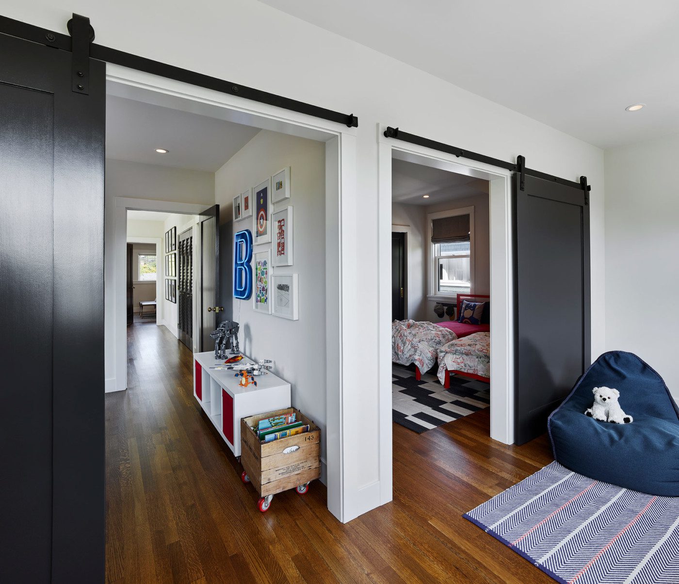 black barn doors in hallway and bedroom craftsman renovation