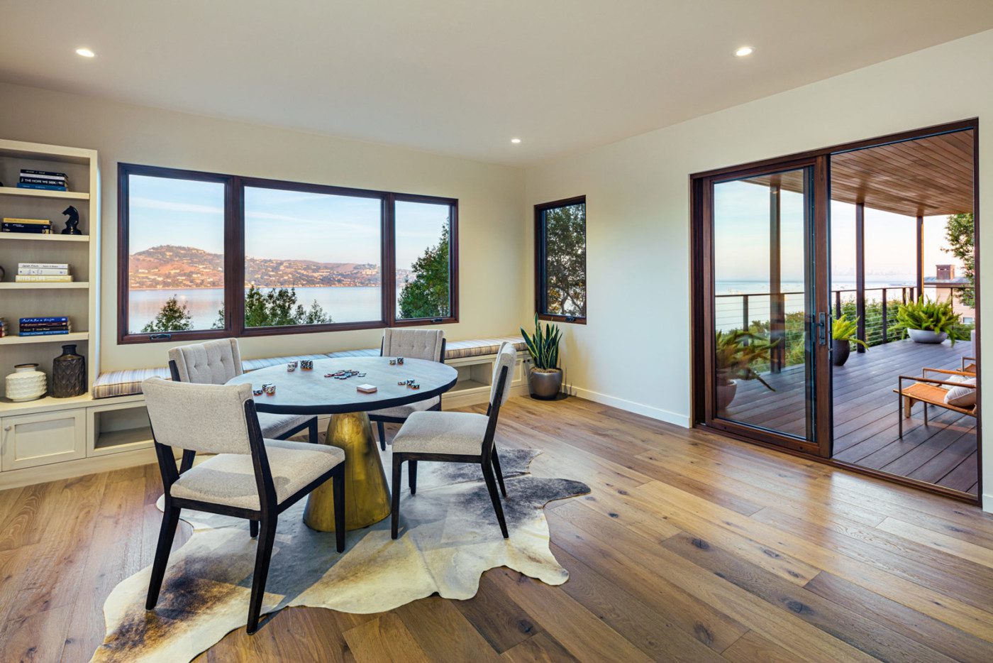 Dining room with view of the bay with wood framed windows in mill valley