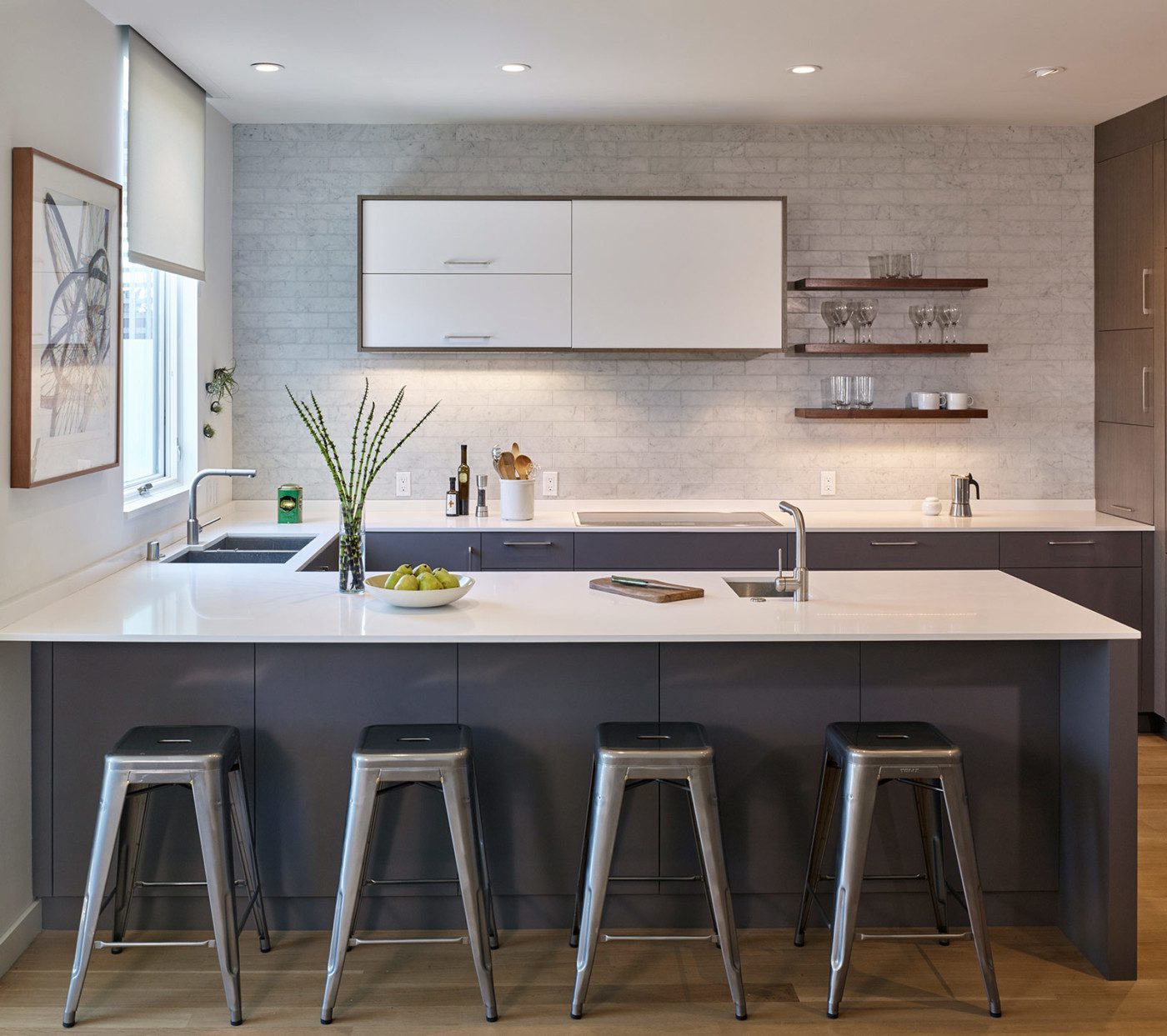 modern kitchen renovation with white counters and dark cabinets noe valley renovation