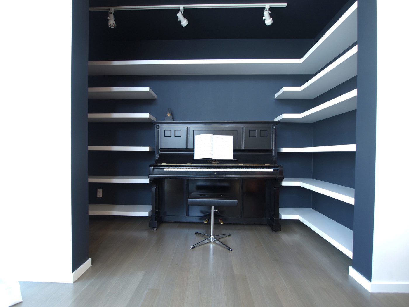 modern dark blue music room with piano in noe valley