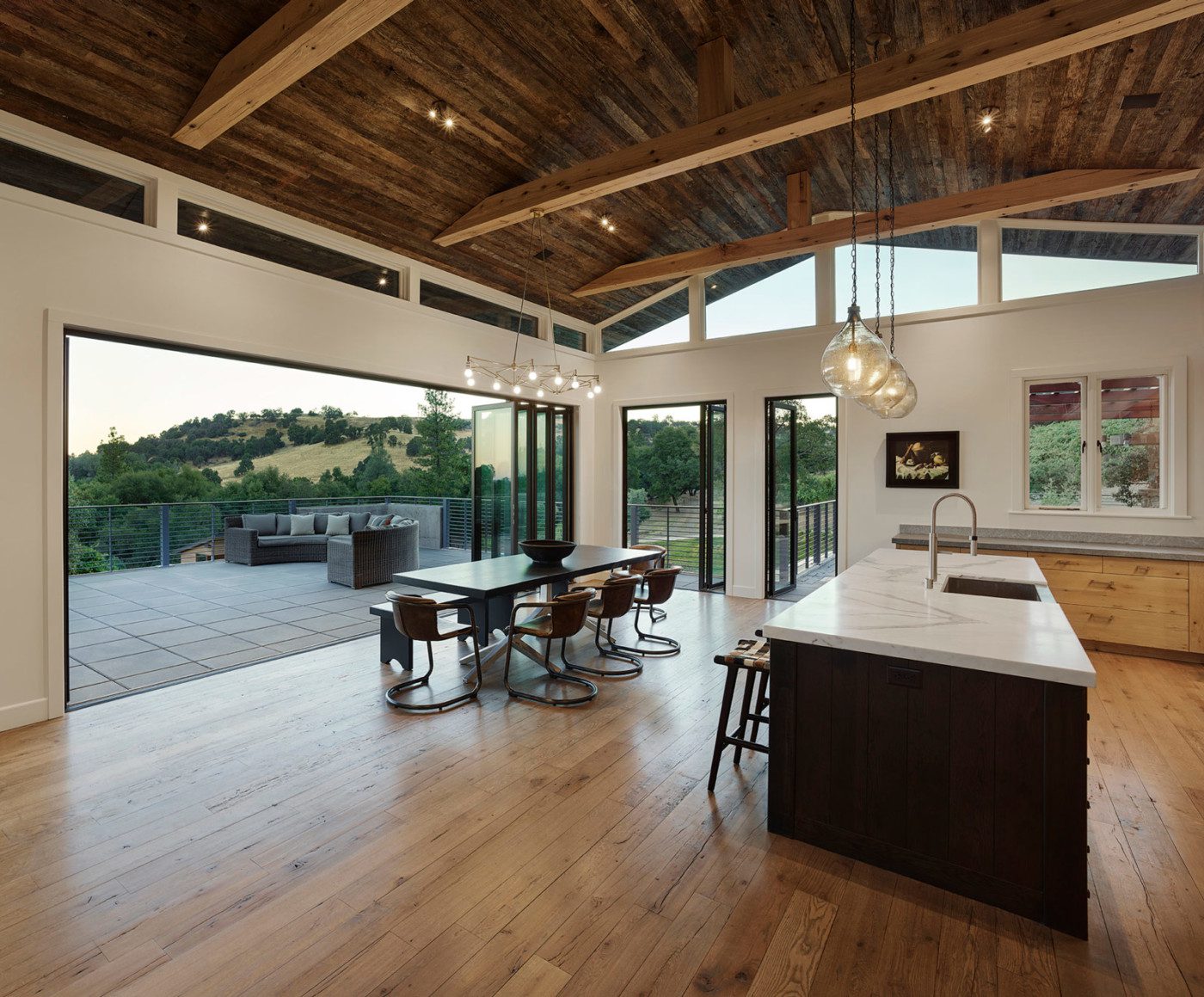 modern rustic open plan kitchen with access to outdoor patio