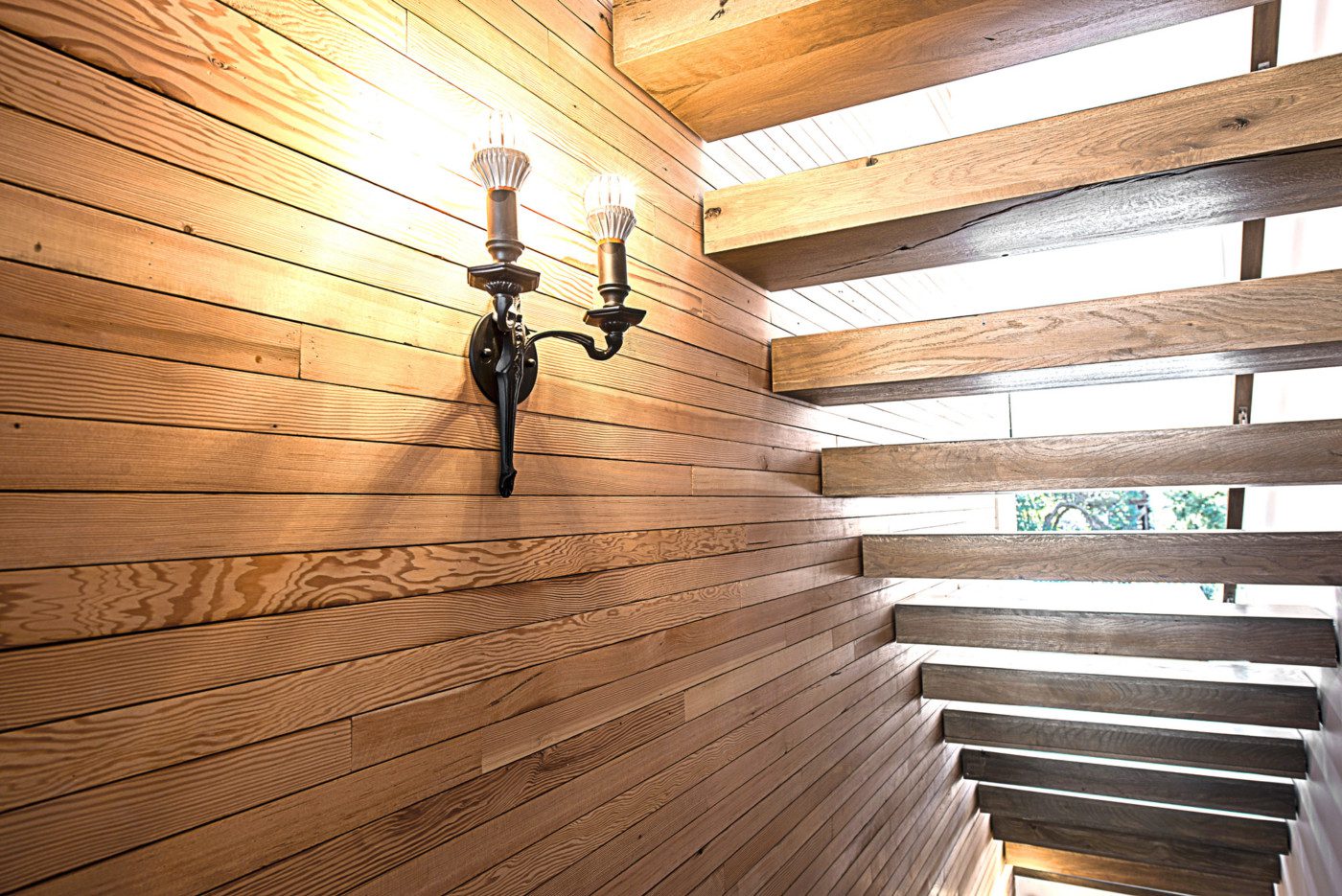 sustainable lighting fixture with wood stairway in noe valley