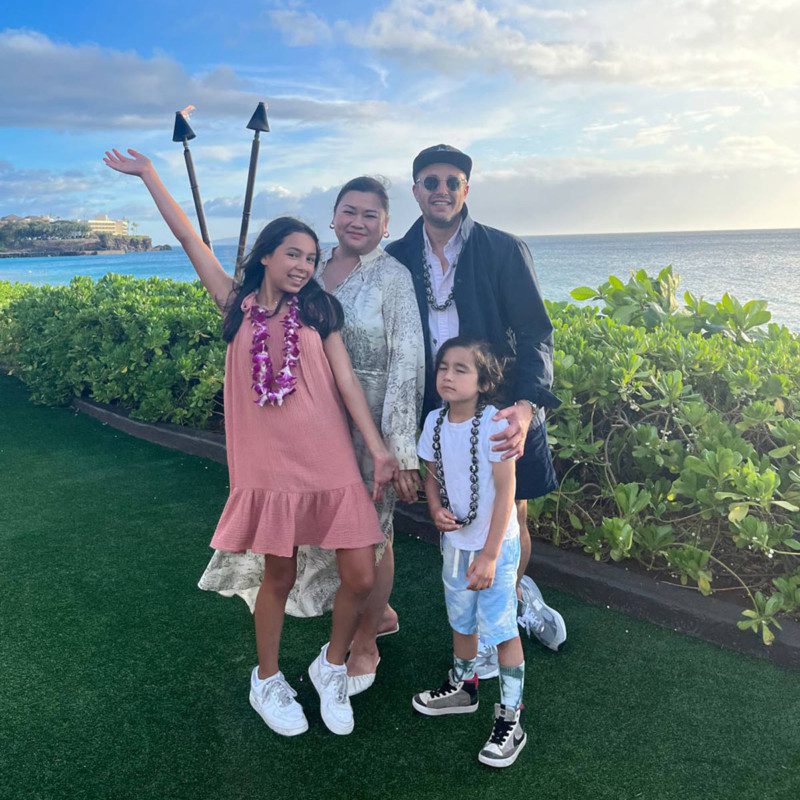 Woman with Her Family with Sea in Background