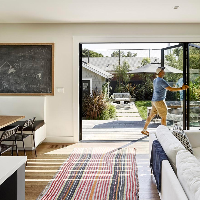 Accordion doors in modern craftsman design build addition project in Alameda CA