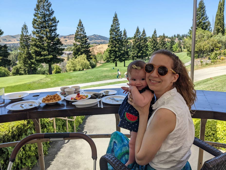 Camila with her baby having breakfast