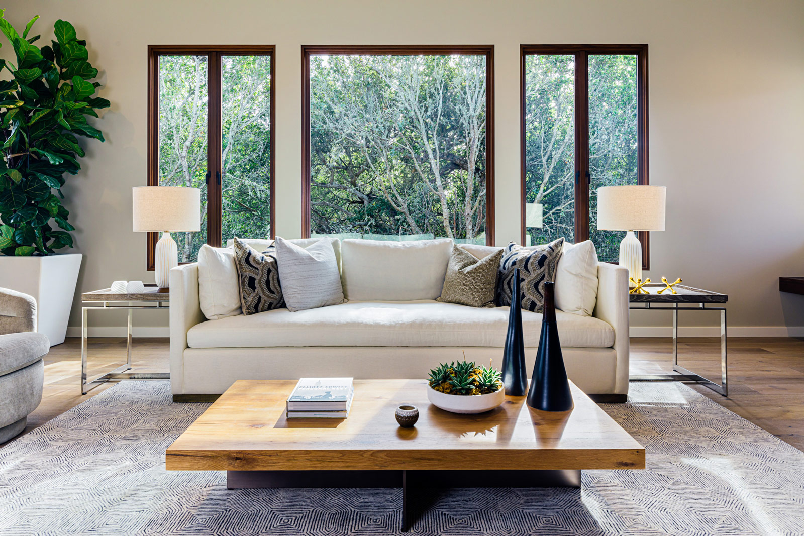 living room with couch and large windows