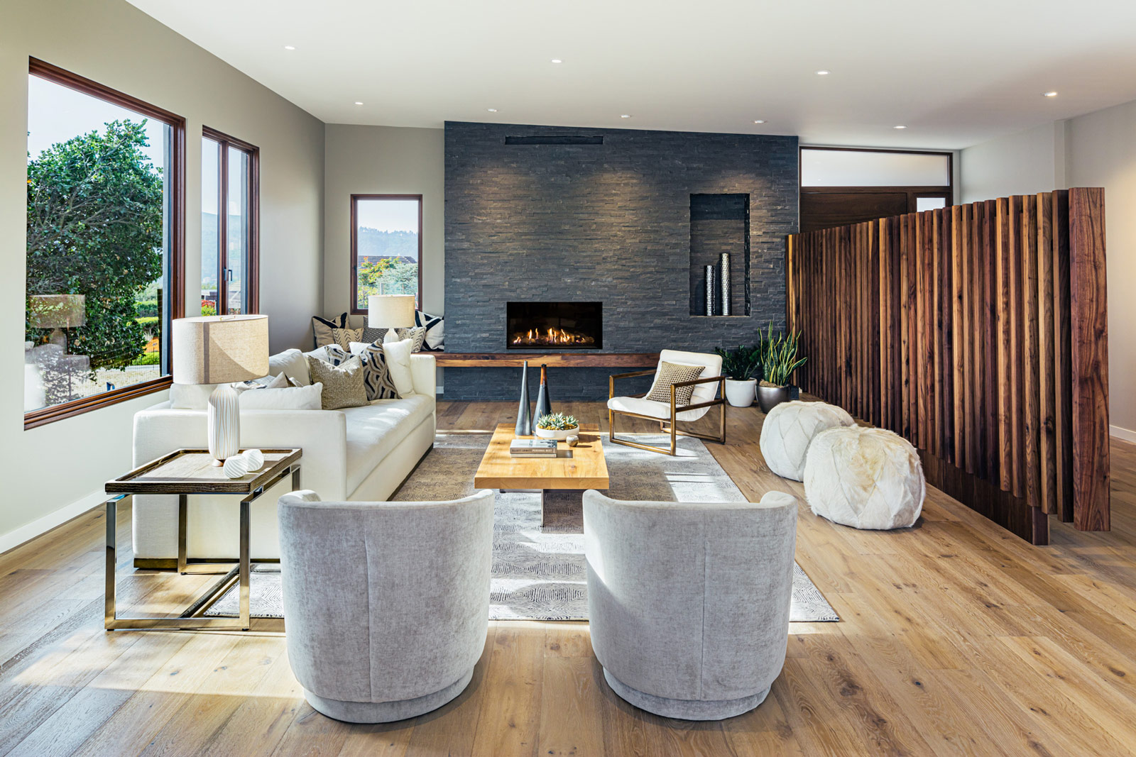 cosy living room with large windows and fireplace