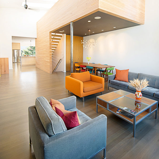 modern blue white and orange living room in noe valley