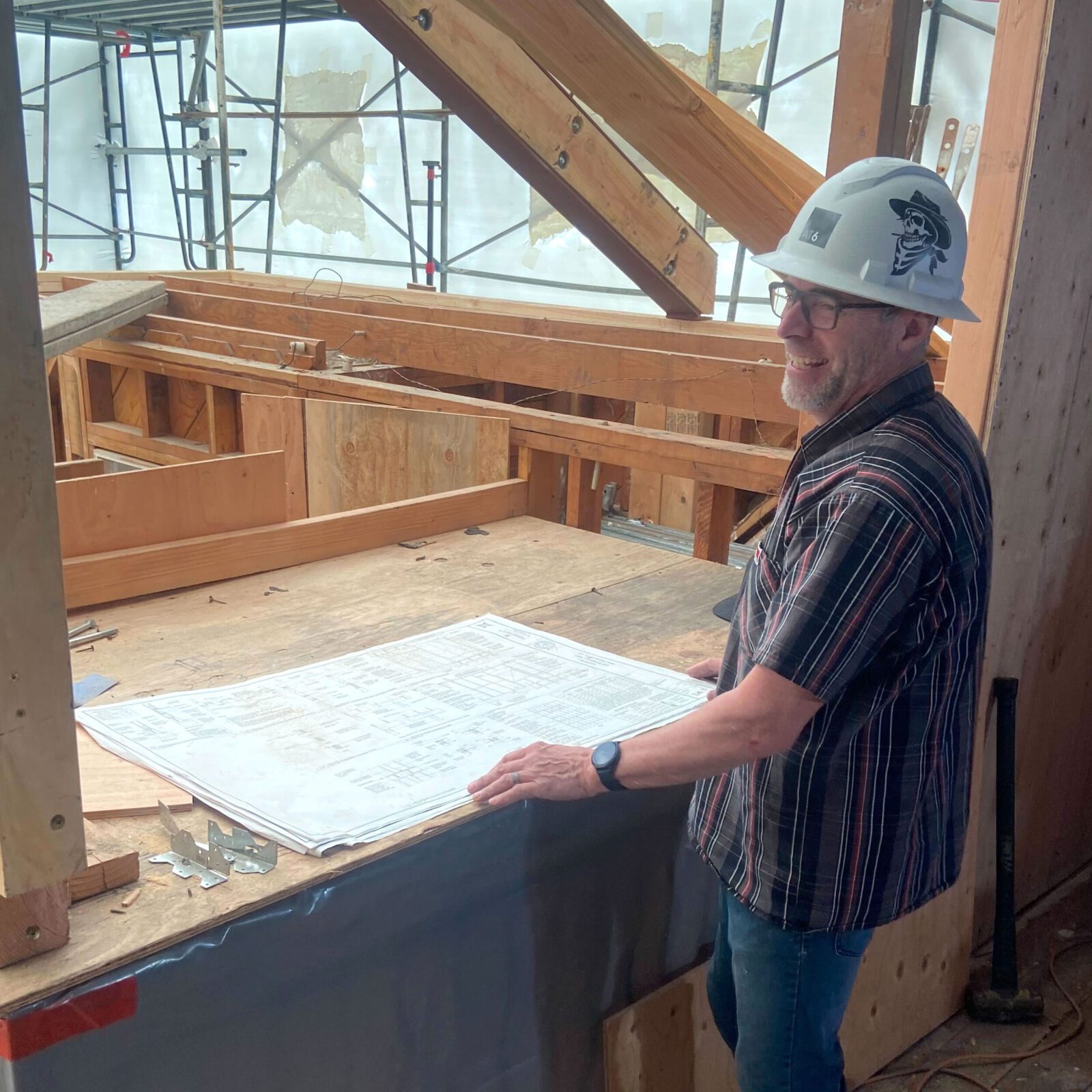 Construction worker with hard hat on site