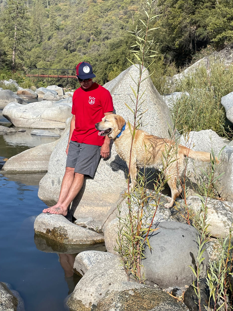 Brad with dog by river