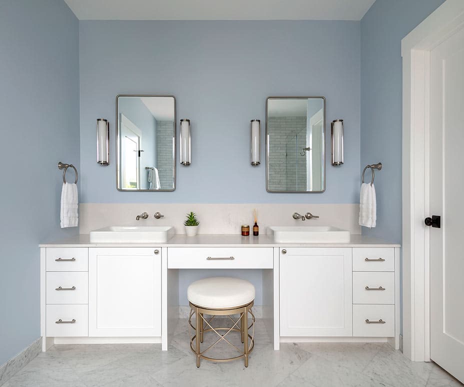Blue and white bathroom with dual sinks in san francisco renovation