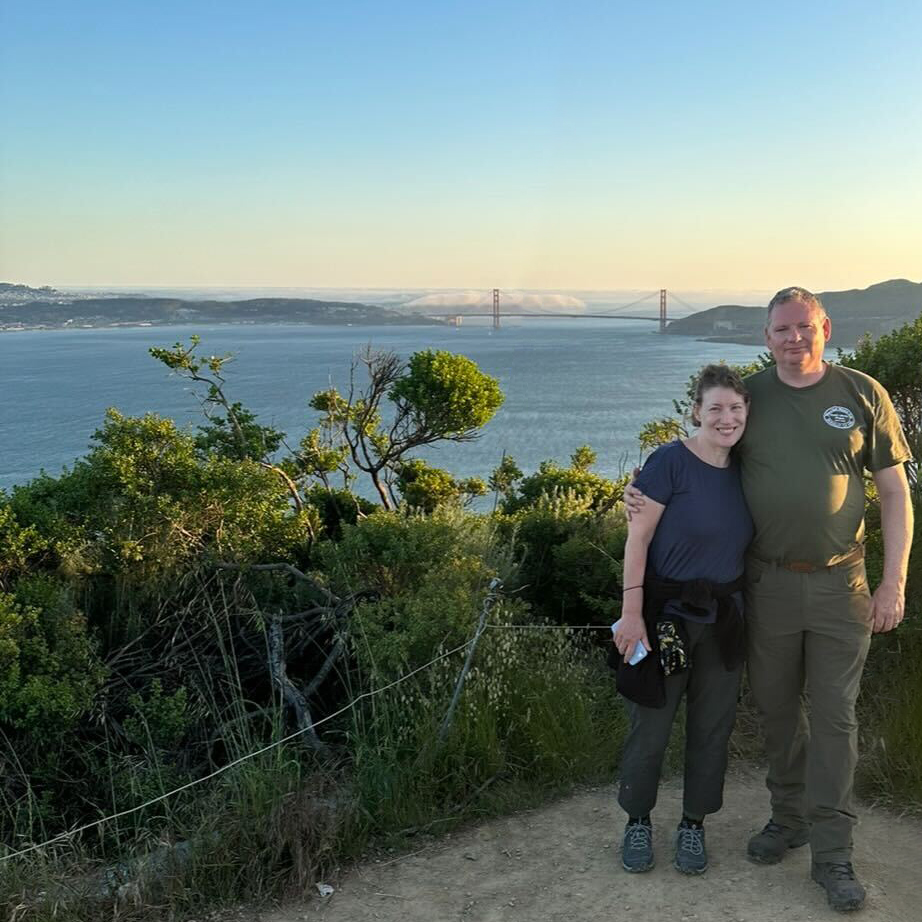 Anthony Gilleece with his wife on top of Angel Island view of Golden Gate Bridge
