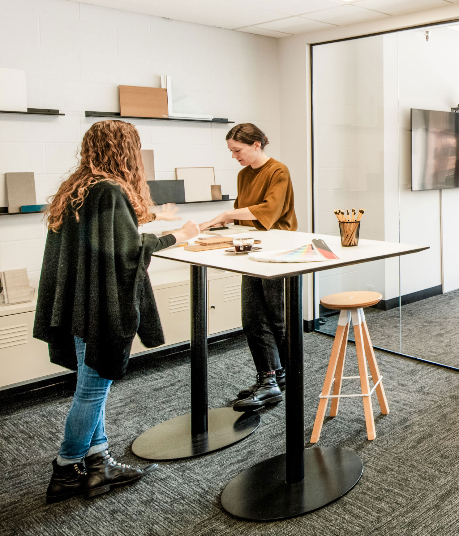 Two woman collaborating in office