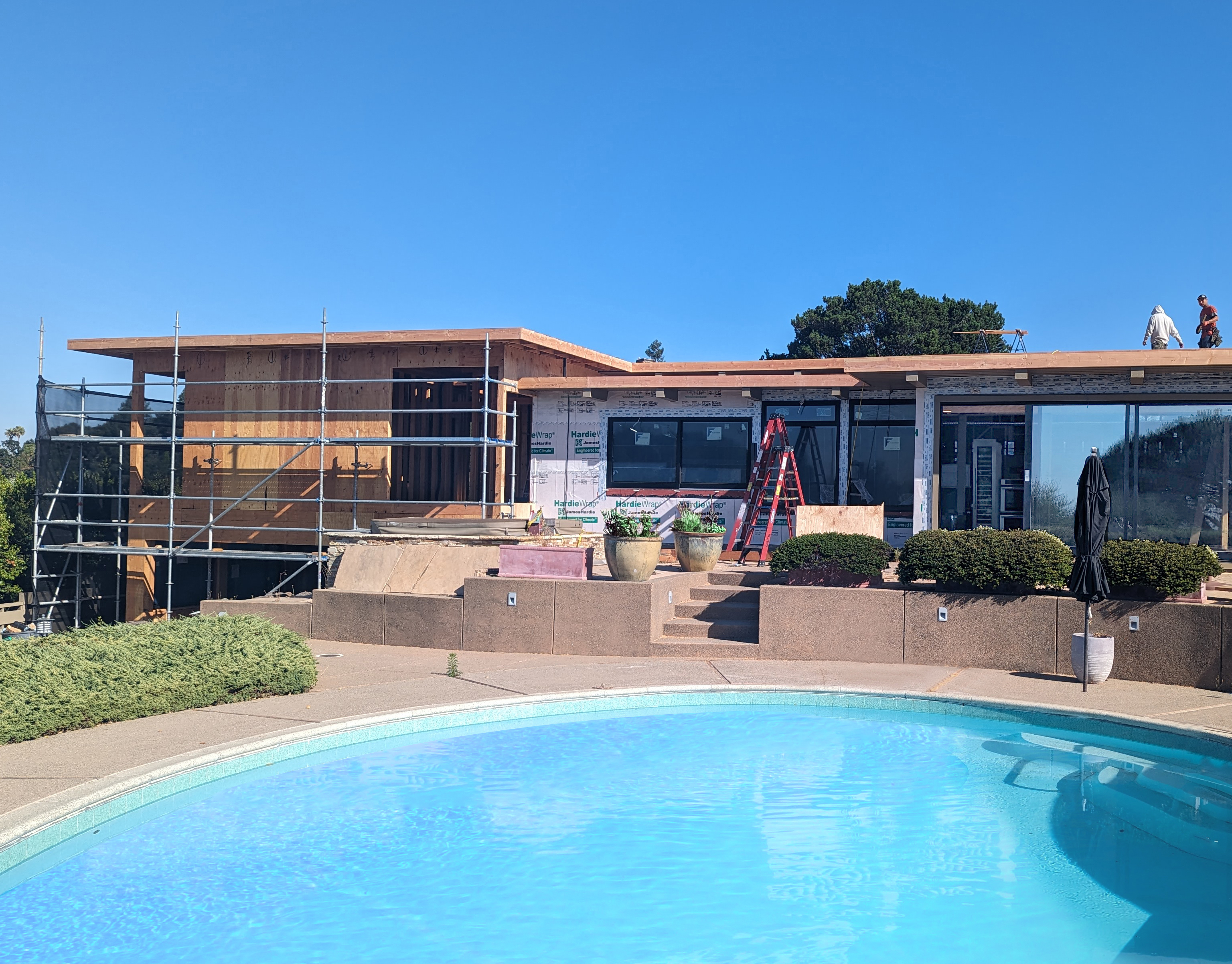 exterior of home in construction with pool